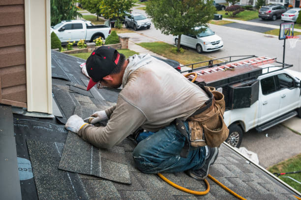 Professional Roof Repair technician working in Nellis, WV